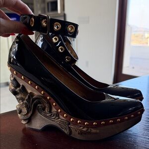 Miu Miu Black Heels with Sculpted Gold Accents